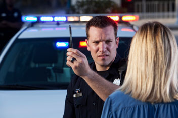 Photo of police officer performing field sobriety test